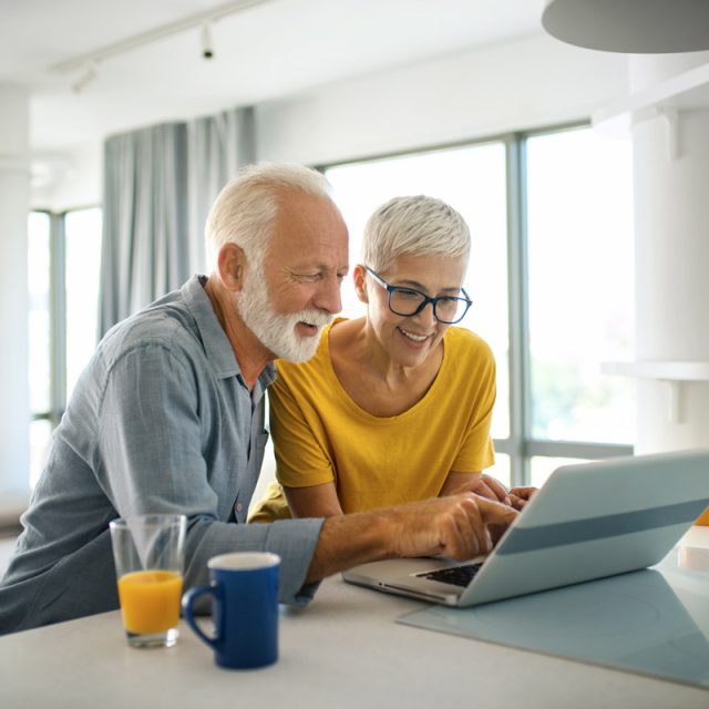 Couple looking at a laptop